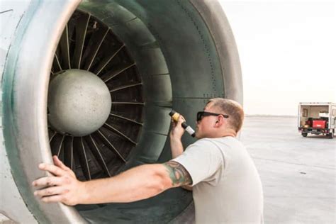 Flight engineer performing inspection