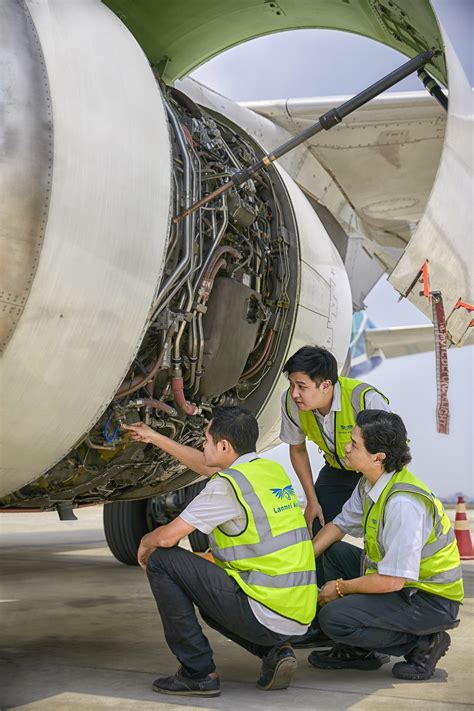 Flight engineer working on aircraft