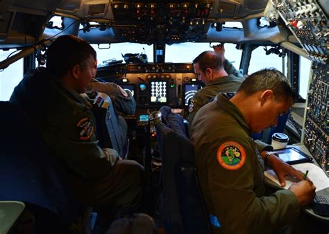 Flight engineer working with pilot