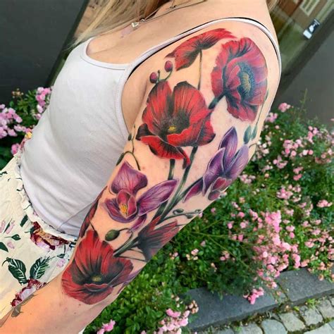 Floral upper arm tattoos