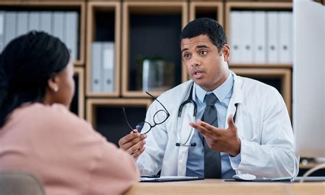 A GP consulting with a patient