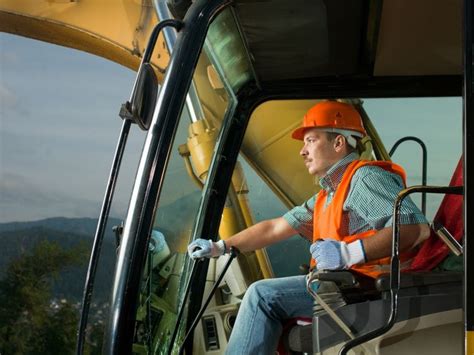 Heavy equipment operator operating a backhoe