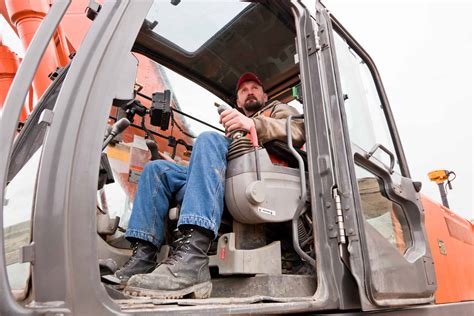 Heavy equipment operator ensuring safety