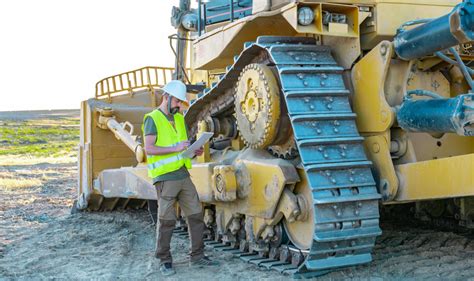 Heavy equipment operator working with a team