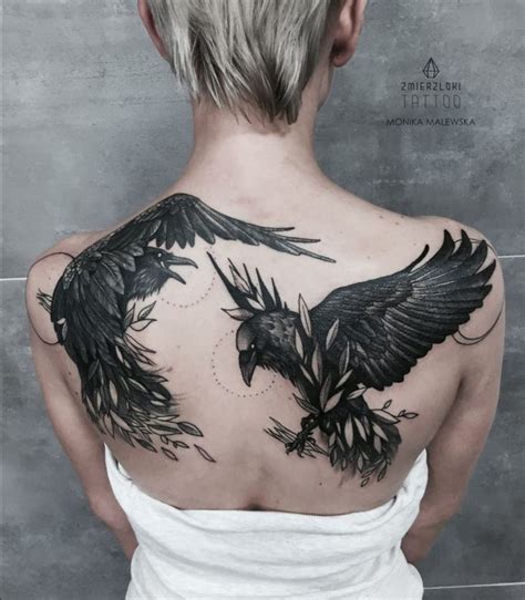 History and cultural significance of raven tattoos