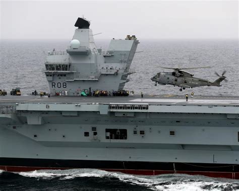 HMS Queen Elizabeth and Merlin helicopter