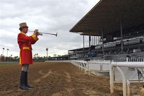 Bugler playing the bugle at a horse racing event