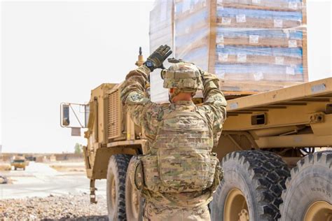 Infantry members loading supplies