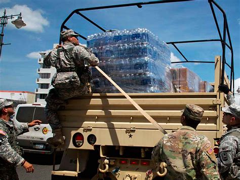 Infantry members loading supplies