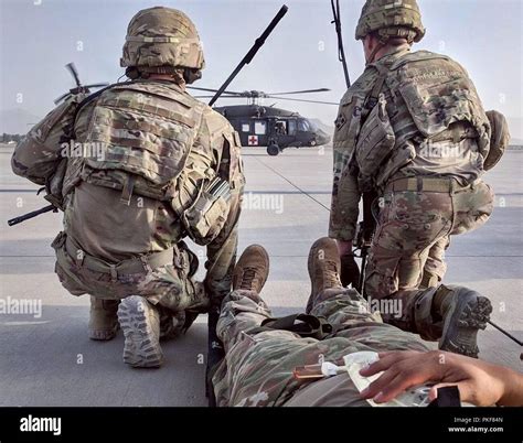 Infantry members providing medical care