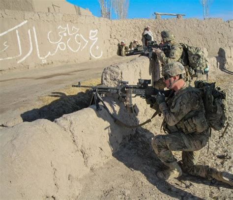 Infantry soldiers in rural combat