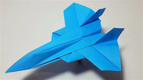 A jet fighter paper plane soaring through the sky