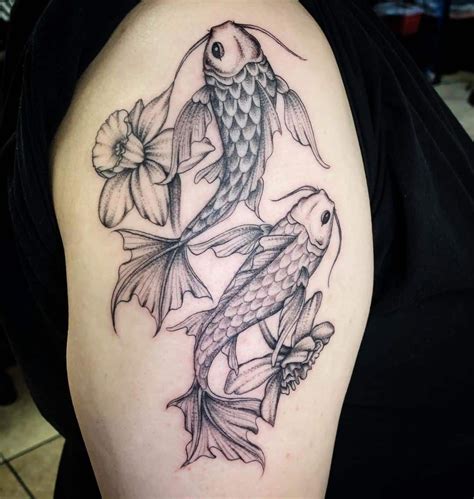 Koi fish tattoo with lotus design