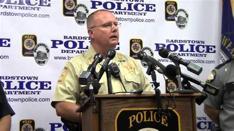 Law Enforcement Officers at a Press Conference