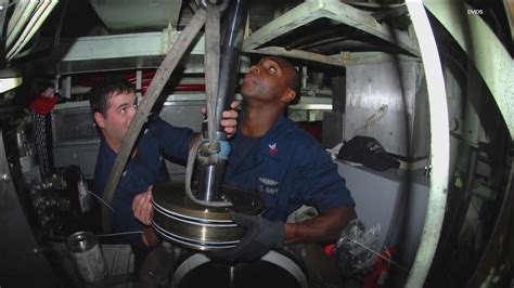 A group of Navy sailors on a ship