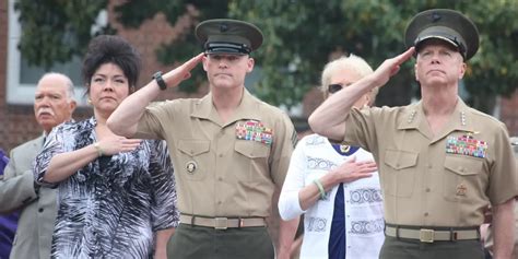 A Marine Corps recruiter explaining benefits