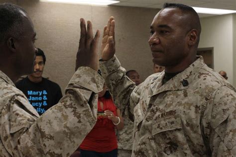 A Marine Corps officer administering the Oath of Enlistment