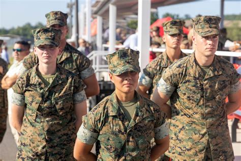 Marine Corps Officer Candidates School graduates receiving their commissions.