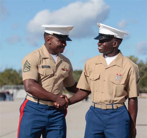 Marine Corps recruiter talking to a potential recruit.