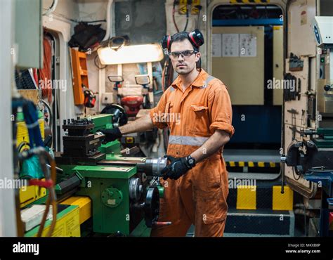 Marine Engineer Working on Ship