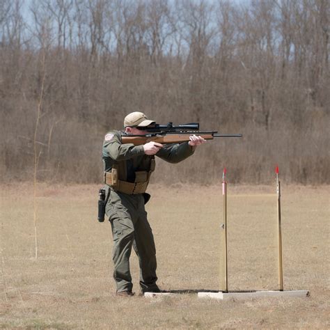 A shooter demonstrating proper marksmanship techniques