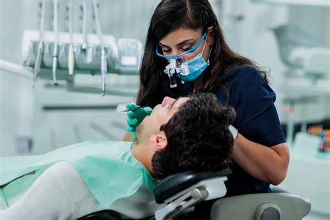 Maxillofacial Surgeon Talking to Patient