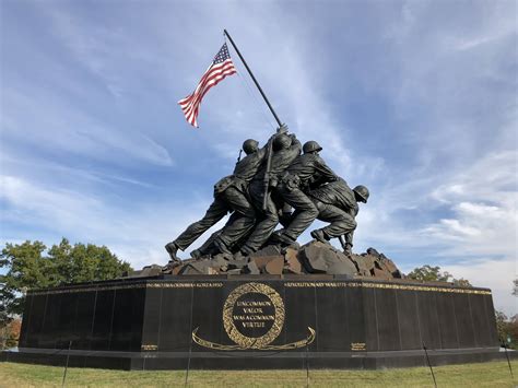 A military memorial with a bugler playing Taps