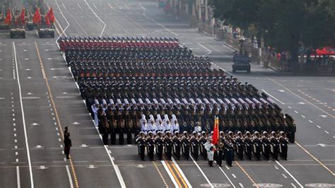 Marines marching in a parade, shouting Ooh Rah