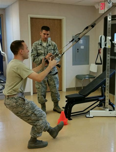 Military Physical Therapist Working with Advanced Technology