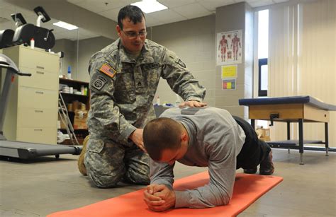 Military Physical Therapist Working with Team