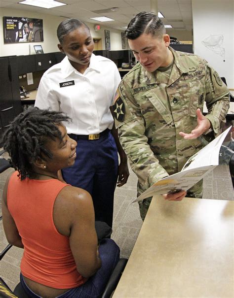 Military recruiter guiding a new recruit through their career options