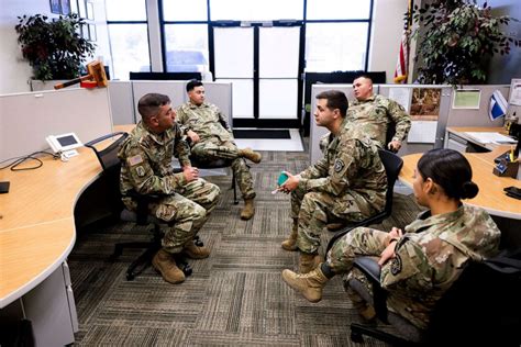 Military recruiter working with a team of recruiters