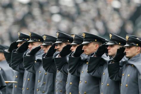 Military personnel saluting during a ceremony