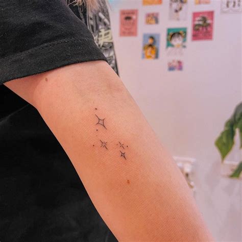 Minimalist stars tattoo on the ankle