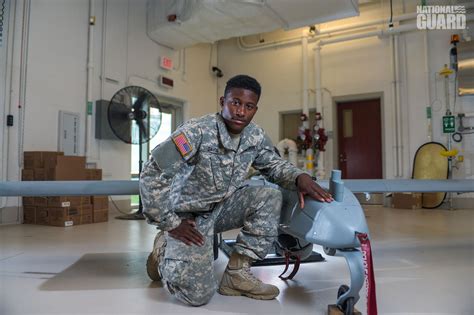 A soldier in uniform in a office setting