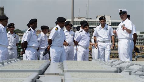 Naval Officer Maintaining Equipment