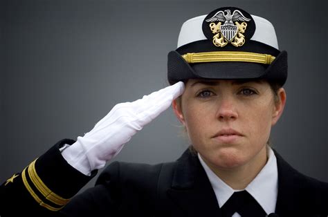 Naval personnel saluting their commanding officer