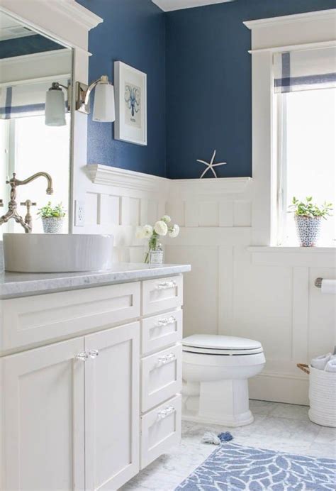 Navy blue and white bathroom with gold accents