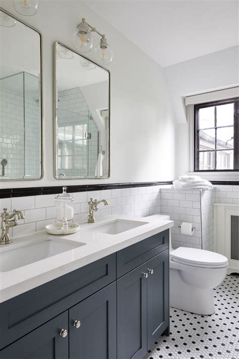 Navy blue and white bathroom with gold accents