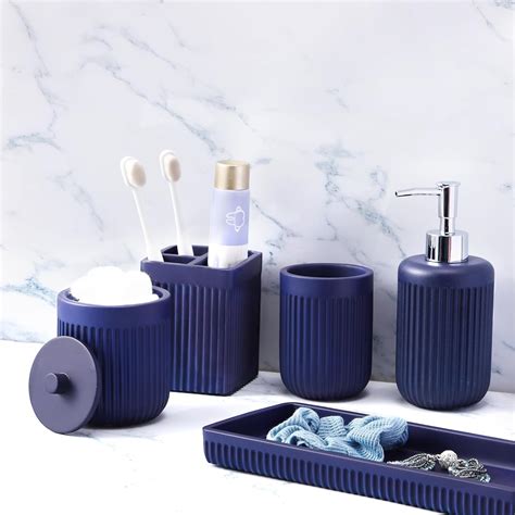 Navy blue bathroom accessories with white accents