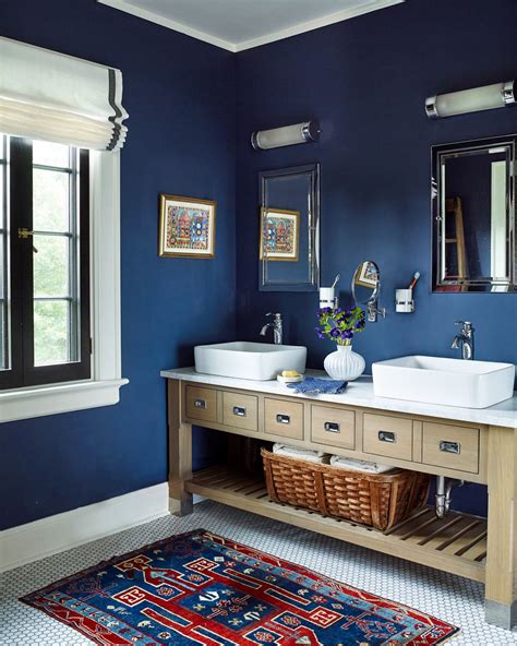 Navy blue bathroom decor with white accents