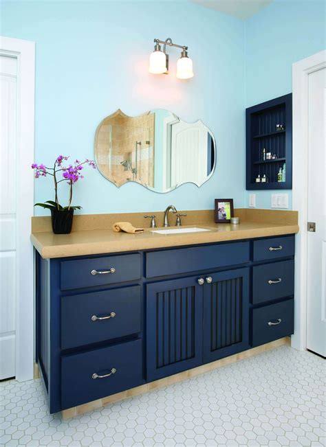 Navy blue bathroom fixtures with gold accents