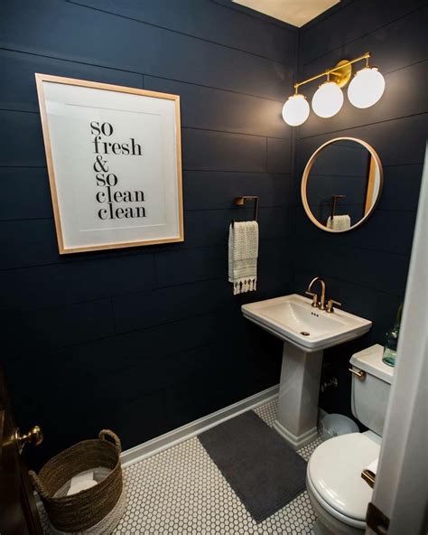 Navy blue bathroom fixtures with gold accents