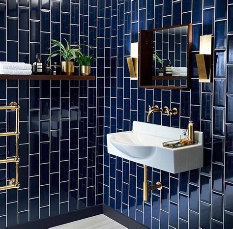 Navy blue bathroom tiles with white grout