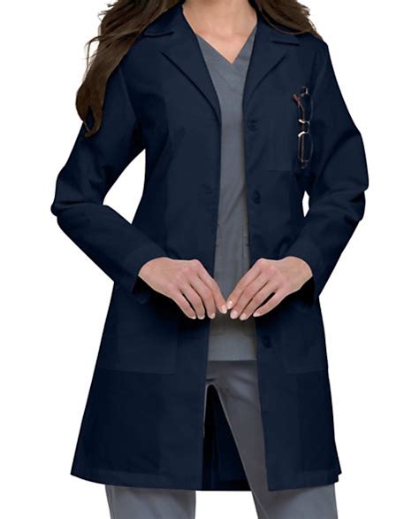 Navy blue scrubs with lab coat