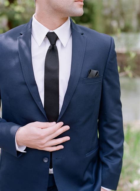 Navy suit with black tie