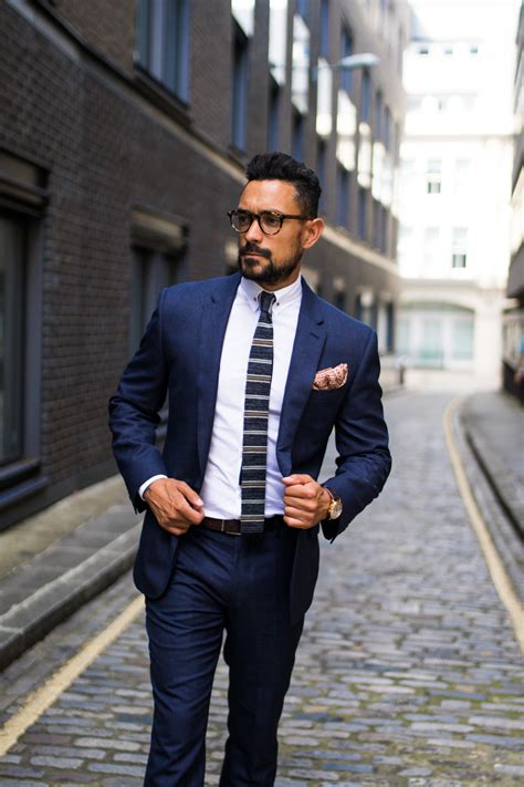 Different styles of navy suits