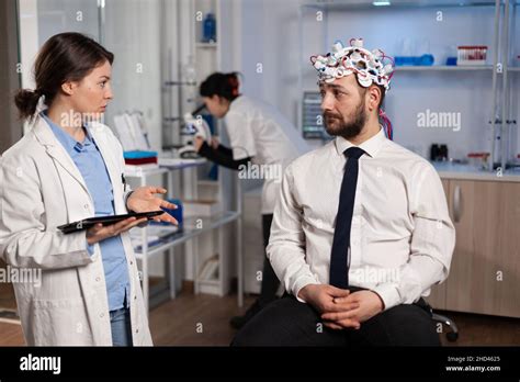 A neurologist discussing treatment options with a patient