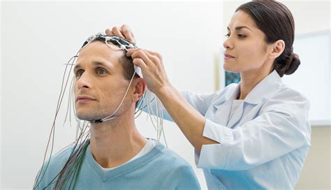 A neurologist educating a patient about their condition