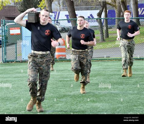 A group of soldiers in uniform, participating in a training exercise